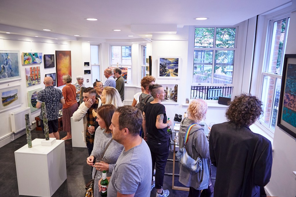 full art gallery viewing a contemporary art exhibition highlighting emerging creatives developing their practice, at Neighbourhood Gallery, organised by an art event expert and curator