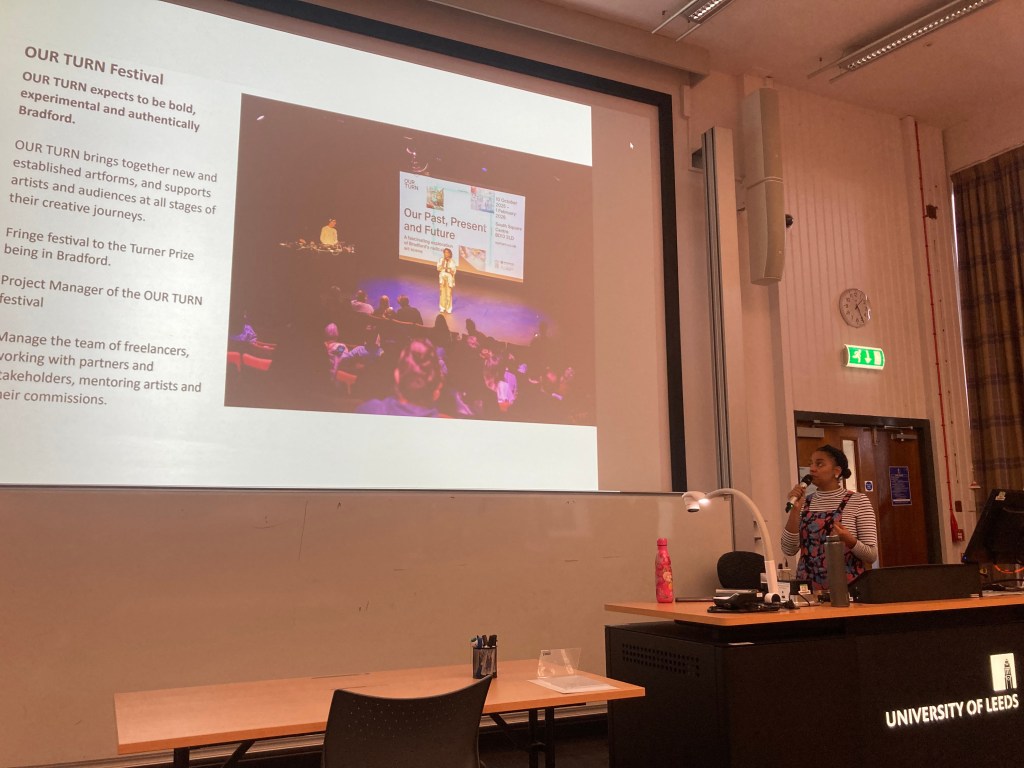 Arts industry guest speaker delivering a talk to university art students in the UK